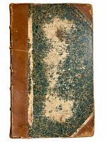 Front cover of an antique book showing worn marbled boards and half leather binding with visible wear and fading.