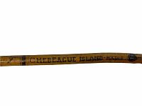 Detailed view of 'Chebeague Island ME' marked on the cane shaft showing signatures.