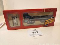 Front view of boxed Corgi Pollock ERF KV 8 Wheel Platform Lorry model with certificate visible inside packaging.