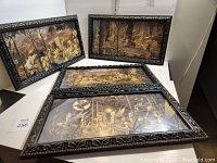 All four framed prints displayed together on table