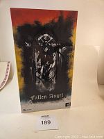 Front view of the Fallen Angel box featuring dark angel artwork and gradient background colors.