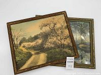 Two vintage framed Wallace Nutting prints overlapping, showing varying frame wear and visible damage to one print.