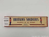 Top and front view of original Britains Soldiers box with branding and illustrations of Grenadier Guards soldiers.