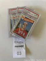 Four Mark McGwire 1985 Topps #401 rookie baseball cards in PSA protective cases, showing front art and label