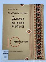 Full front view of the art portfolio folder showing title 'Guatemala Indians Galvez Suarez Paintings' and decorative border pattern.