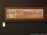 Full view of the framed fox hunt artwork hanging on a wall, showing the whole composition and frame design.