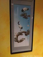 Framed Asian 3D artwork showing three cranes on pine branches with blue background.