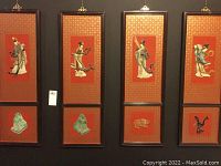 Full view of four framed Asian inlay artwork panels arranged in two rows; each panel approximately 12x36 inches with central figure inlaid artwork and smaller inset inlay below.