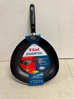 Top view of the T-fal triangular pan showing label with brand, capacity, and thermo-spot heat indicator.