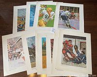 Set of 13 large sports posters featuring Canadian athletes in various sports poses, laid out on floor.