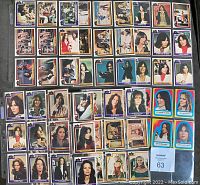 Full view of nearly complete Series 3 Charlie's Angels cards along with several stickers, laid out in multiple rows showing different characters and scenes.