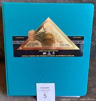 Cover photo of green binder containing the 1996 Select Certified Football Card set with original label on front.