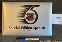 Silver custom binder cover embossed with NHL 75th anniversary logo and text 'Special Edition 1991-1992'