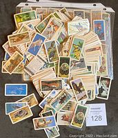 A pile of assorted Red Rose Tea collectible cards showing various illustrations of birds, animals, and nature scenes.