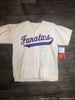 Full view of vintage Fanatics flannel baseball jersey with purple lettering and visible wear.