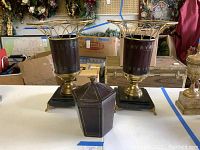 Overall view of two leather-wrapped vases and matching leather box on table