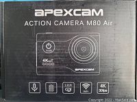 Photo of Apexcam Action Camera M80 Air packaging showing model name and key features including 4K video, WiFi, microphone, and 131ft waterproof capability.