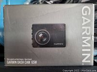 Front of the Garmin Dash Cam 65W box showing an image of the dash camera and branding with product name.