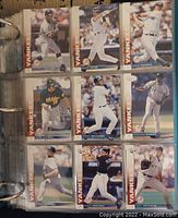 Photo showing 9 individual baseball cards featuring New York Yankees players in action, each with a border labeled 'Yankees'