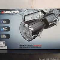 Front view of the Monster Adventurer Force speaker box showing Bluetooth 5.0, IPX7 waterproof rating, and 18+ hours battery life features.