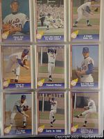 Close-up photo of baseball cards featuring Nolan Ryan in various poses including pitching and action shots, cards are Pacific 1991