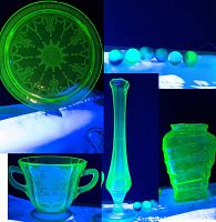 Group shot under blacklight showing fluorescent glow of all five glass pieces and seven marbles.