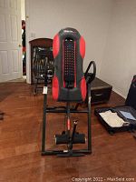 Front view of the Health Gear inversion table showing padded backrest and ankle holders.