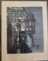 Close view of the framed hand-colored etching featuring a gothic street lamp and half-timbered building with illuminated window.