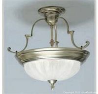 Front and side view of the light fixture mounted showing the frosted melon glass shade and brass curved mounts