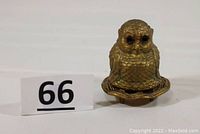 Front view of antique owl-shaped incense burner marked Vantines 1008