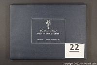 Closed blue presentation case labeled Danbury Mint Men in Space Series