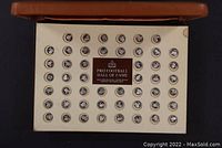 Top-down view of full set of 50 coins in original display case with branded insert