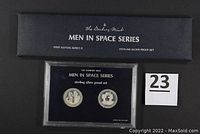 Four medals from Apollo XII, Apollo XIII, Apollo XIV, Apollo XV with box cover showing "Men in Space Series" First Edition, Series II, Sterling Silver Proof Set text.
