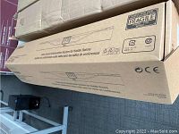 Outer shipping box containing the Yamaha CS-700 video conferencing sound bar, marked FRAGILE