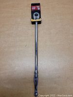 Front view of Husky 15 inch 3/8 inch drive ratchet with original packaging tag attached.