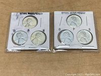 Two cardboard holders each containing three 1943 steel pennies with mint marks D, P, and S.