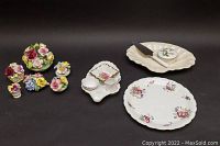 Photo showing the set of floral porcelain bouquets, the Spode leaf serving plate with miniature creamer and sugar bowl, and the Coalport Shrewsbury cake plate with cake cutter and Wedgwood trinket box