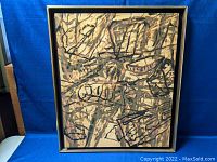 Framed abstract painting by Gar Smith against blue background