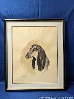 Framed watercolor painting showing full artwork of dog portrait by Robert Milner