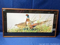 Framed silkscreen print showing two pheasants in natural setting