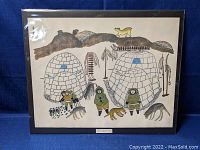 Front view of matted and sleeved print showing igloos, figures and animals under plastic