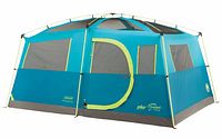 Front exterior view of assembled blue/gray cabin tent showing zippered door and large mesh windows.