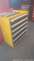 Front and side view of the yellow 5-drawer tool box showing overall condition.