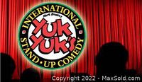 Yuk Yuk's International Stand-Up Comedy logo on red stage curtains