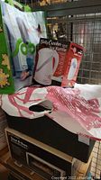 Photo of Betty Crocker Jug Kettle in original box next to other boxed kitchen electronics and plastic bags.