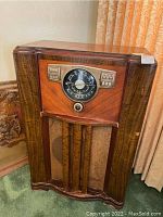 Front view of wooden floor console radio cabinet