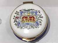 Top view of the round enamel box showing detailed hand-painted crown and Silver Jubilee design