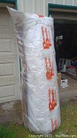 Photo of the large roll of Boulton insulation wrapped in branded plastic showing the full height and branding.