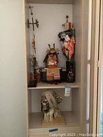 Wide view showing the samurai armor, pole with fish koi, and standing Kabuki-style figure