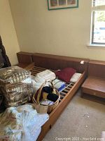 Full view of bed frame and left nightstand with attached headboard